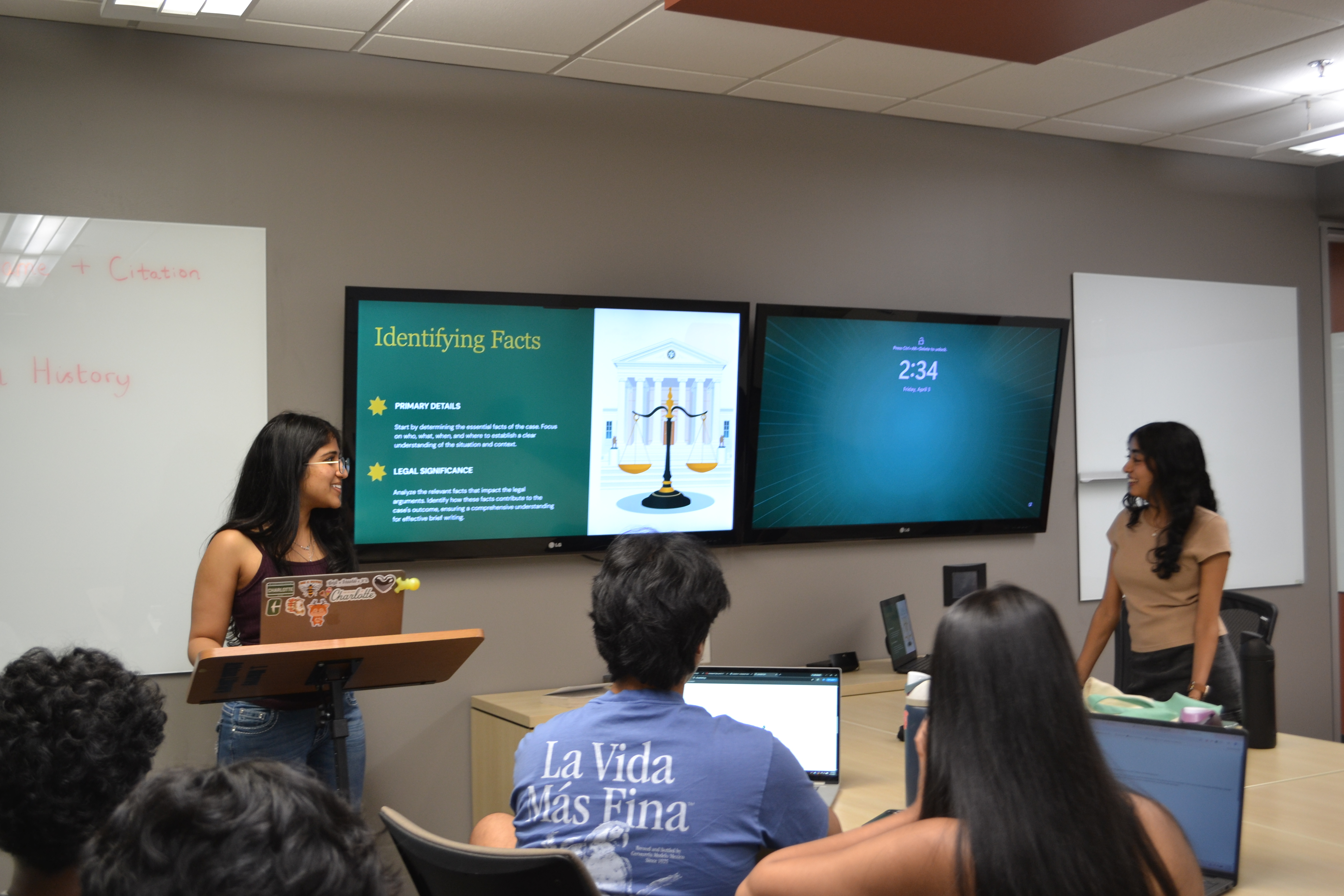 Case Brief Club members walking through the six parts of a case brief during a meeting.
